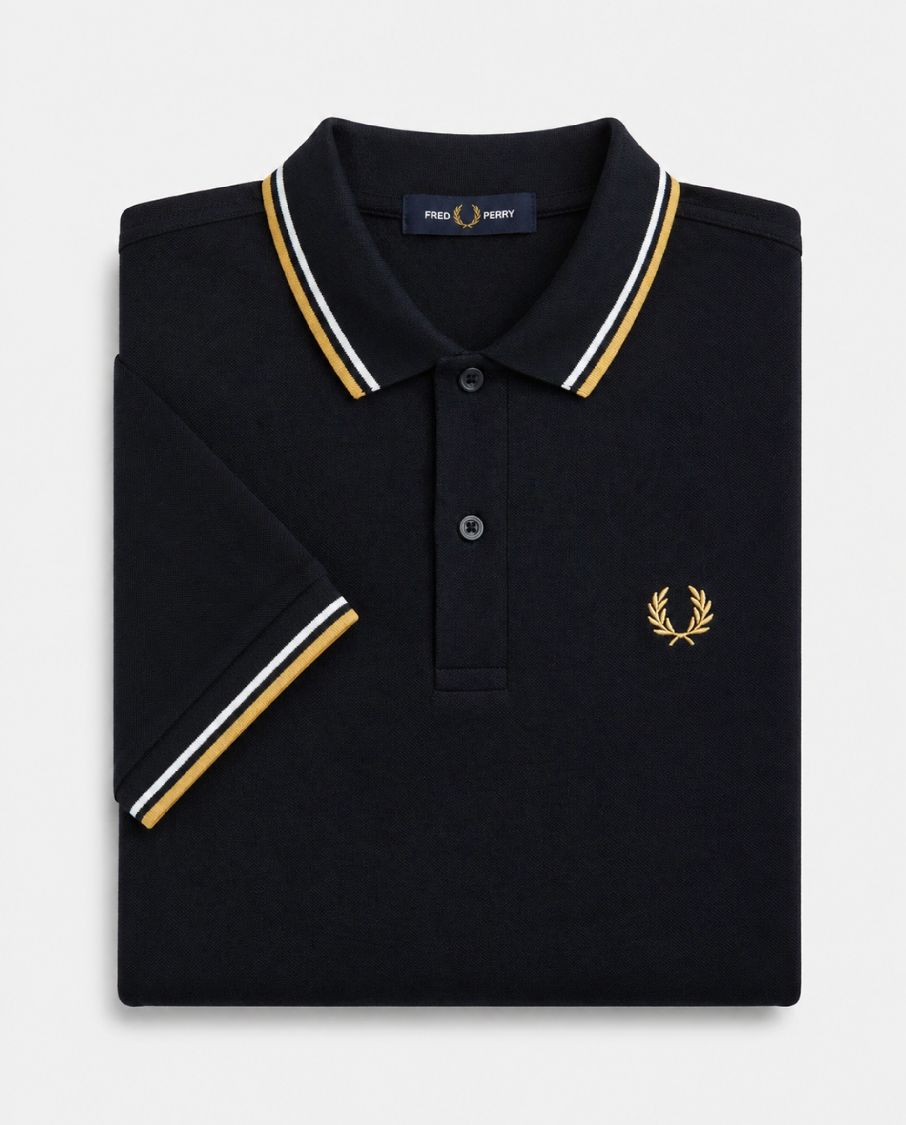 Polo de algodón doble banda negro dorado Fred Perry