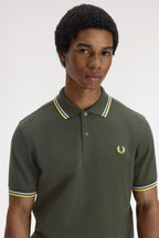 Polo de algodón doble banda verde Fred Perry