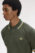 Polo de algodón doble banda verde Fred Perry