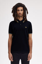 Polo de algodón doble banda negro dorado Fred Perry