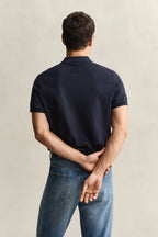 polo azul marino gant hombre vista trasera algodón corte cómodo